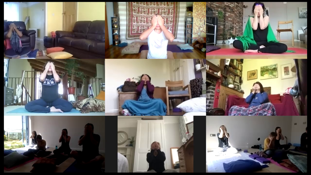A Zoom screenshot showing the participants of the Home Yoga Retreat, covering their faces at the final moment of the yoga session