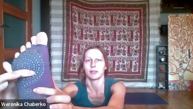 Weronika shows acupressure points on the foot during the online Self Love workshop